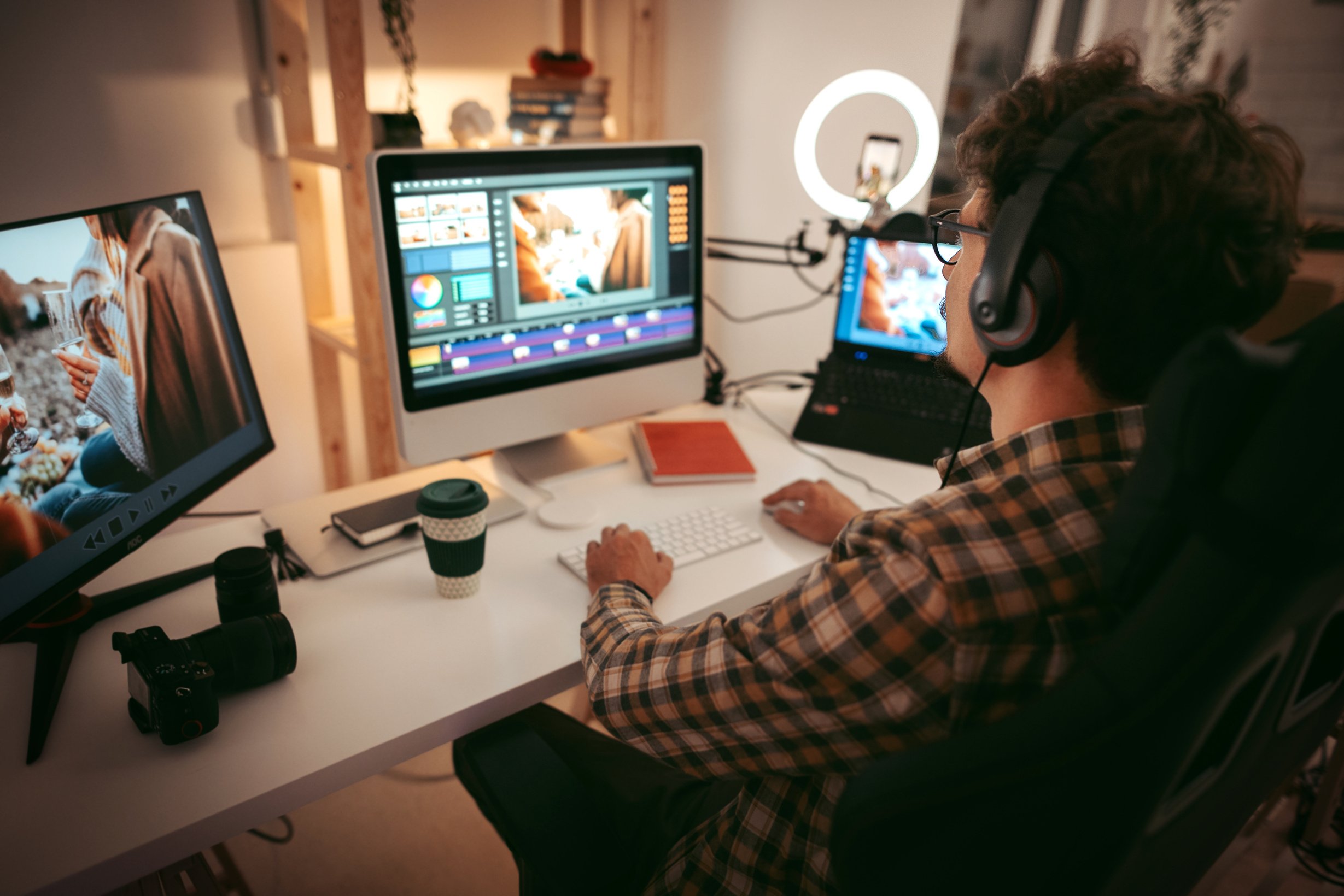 Young man editing video at the home office